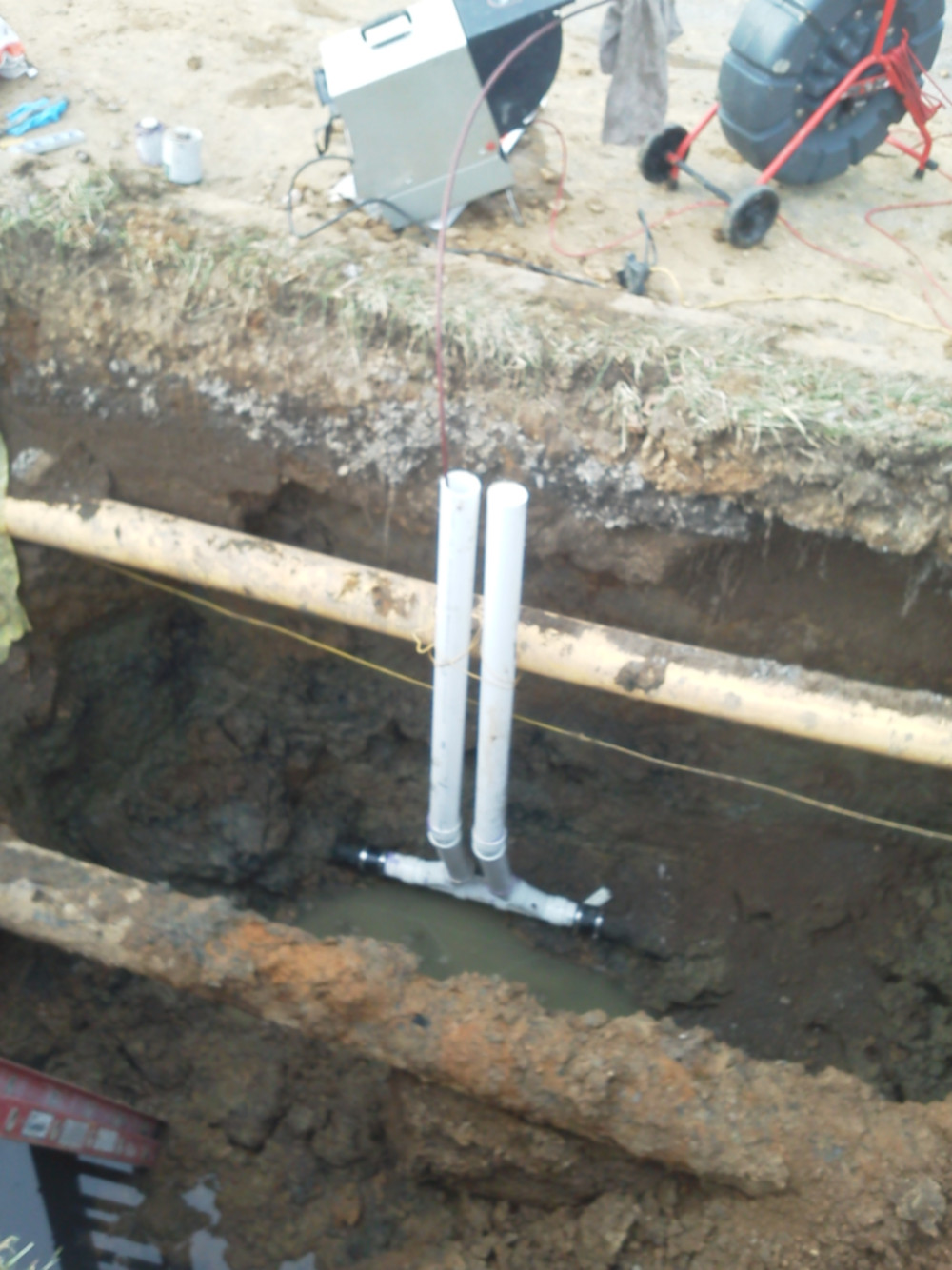 video-inspection drain and sewer video inspection camera equipment above dug open sewer trench